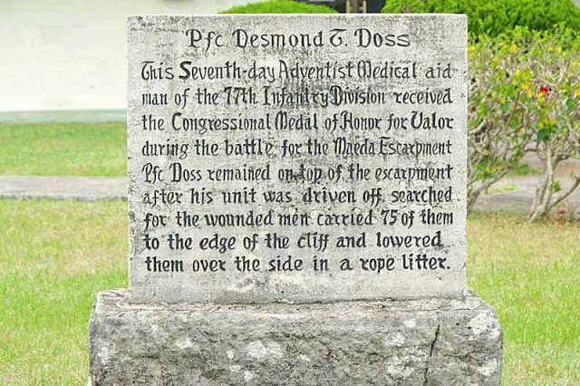 Stone marker dedicated to Pfc. Desmond Doss