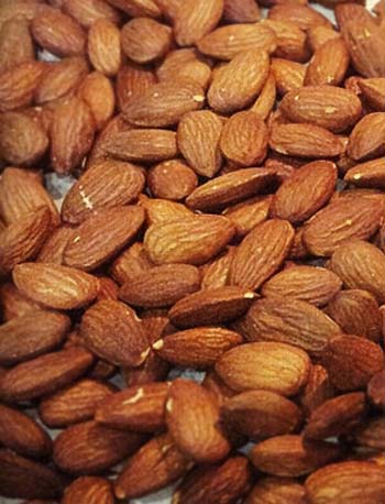 Nuts, such as almonds, contain healthy proteins to improve skin for anti-aging.
