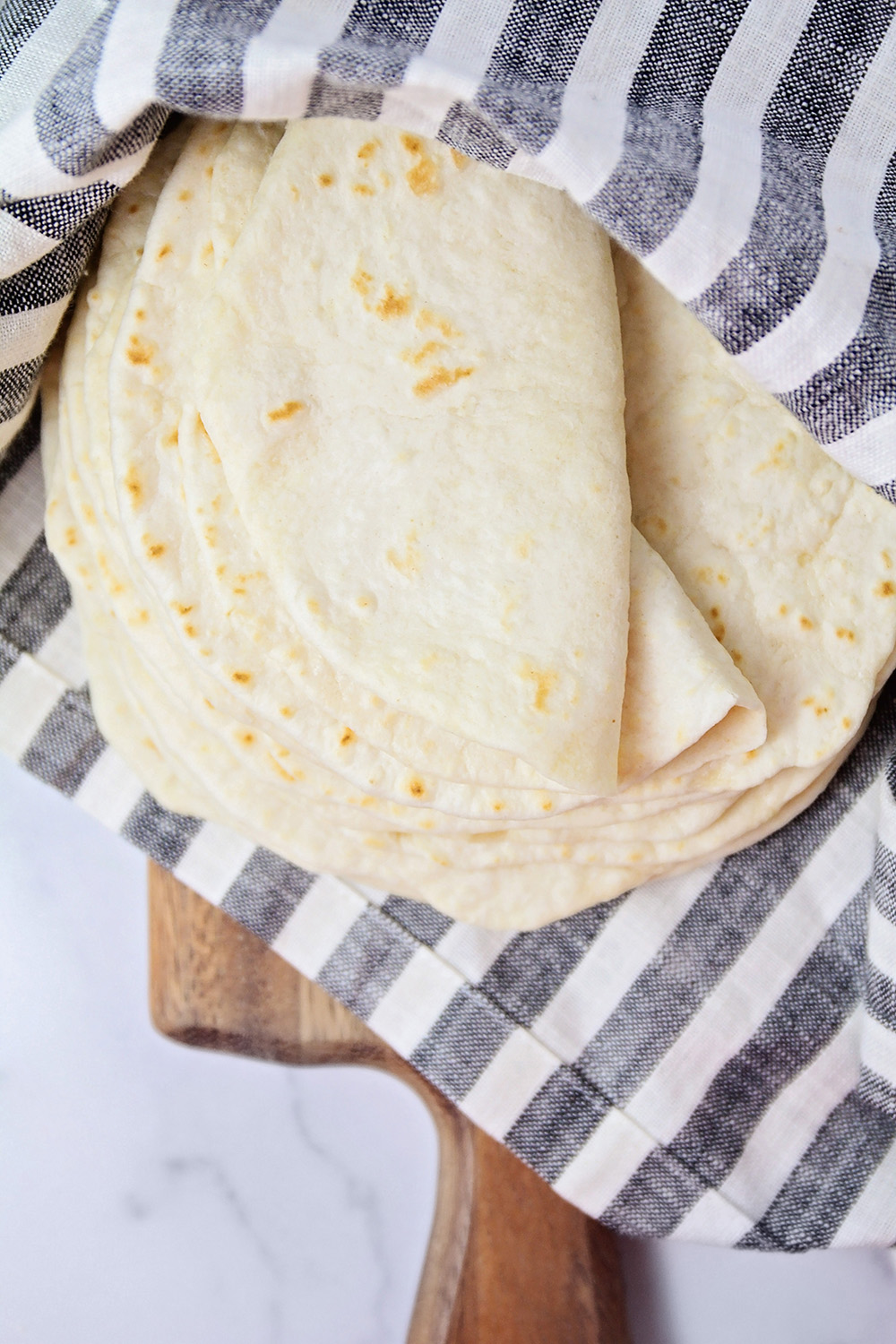 These soft homemade flour tortillas are perfect for tacos, enchiladas, burritos, and more! They're so delicious and so easy to make!