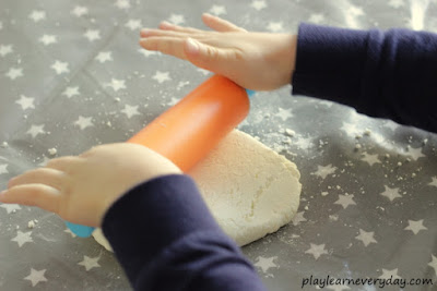 rolling out the gingerbread play dough