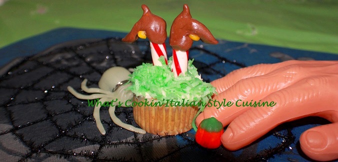 these are the boots recreated of the wicked witch of the east stuck upside down in a chocolate cupcake for Halloween Parties fun food . A recreation taken from the Wizard of Oz wicked witch of the East for this idea to make her boots upside down in a cupcake with candy