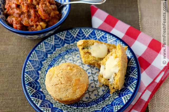 warm cheesy chile corn muffins with melted buttery spread
