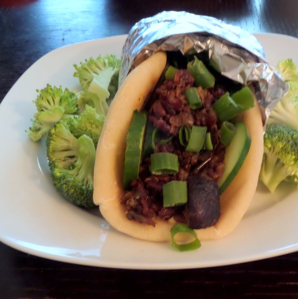 Spiced Eggplant and Mushrooms Sandwich:  Spiced eggplant & mushrooms wrapped in a warm pita with hummus and veggies.  An easy meatless sandwich with Mediterranean flavor.