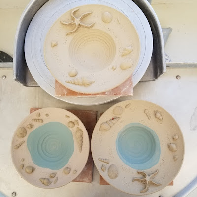 Beautiful seashell / beach themed pedestal plates in progress by Tiger Lily Pottery.