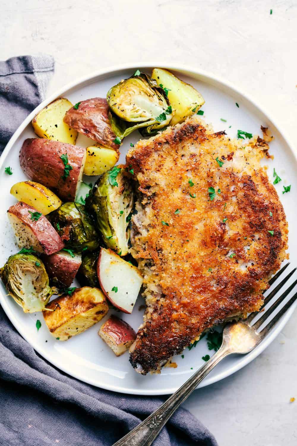 Sheet Pan Crispy Cheddar Pork Chops with Potatoes and Brussels Sprouts