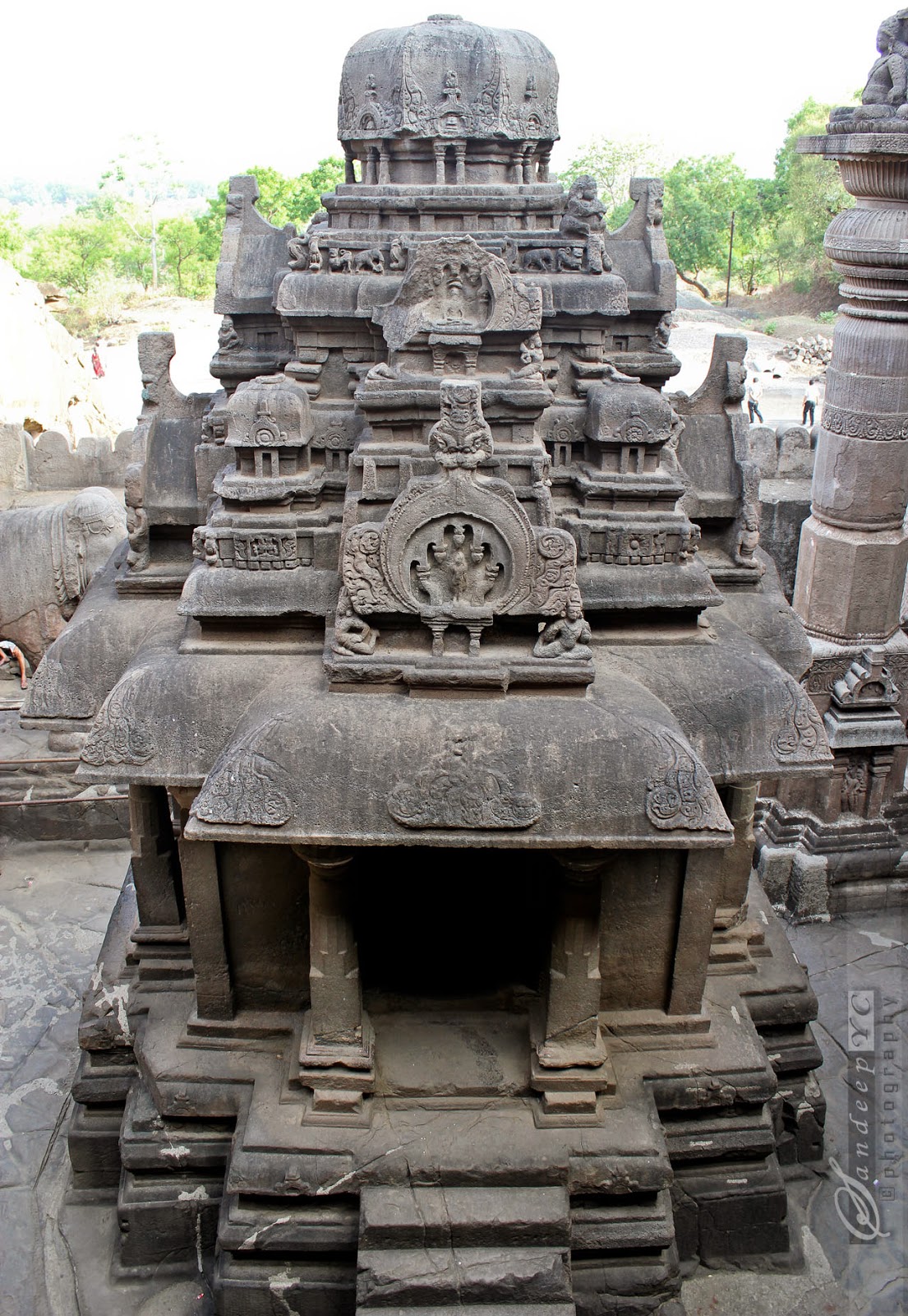 exquisitely carved monolithic shrine at the center of the courtyard
