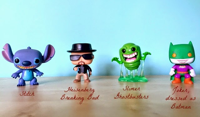 Morgan's Milieu | Pop! Vinyl Figure Review: A photo of four vinyl figures - Stitch, Heisenberg from Breaking Bad, Slimer from Ghostbusters and the Joker dressed as Batman.