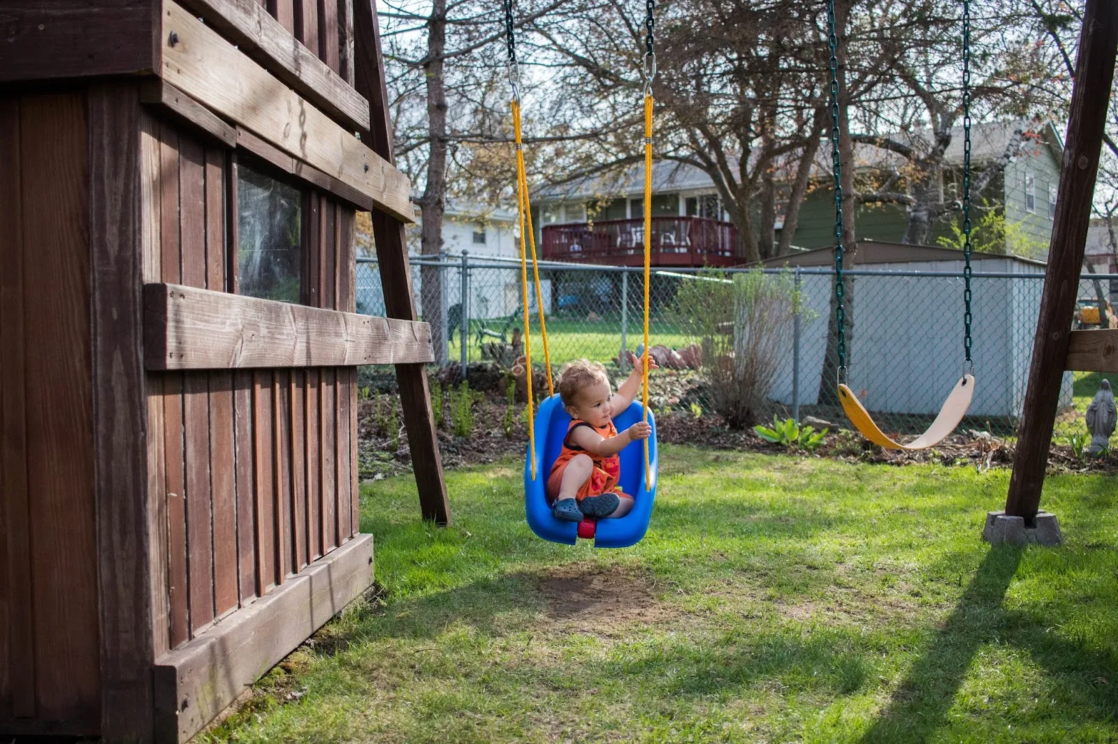 A low accessible swing for toddlers in our Montessori outdoor space.