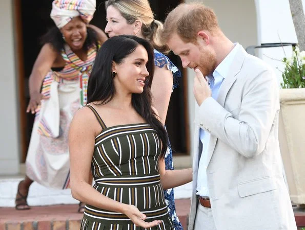 Meghan Markle, The Duchess of Sussex, wore Martin Grant pleated stripe long dress
