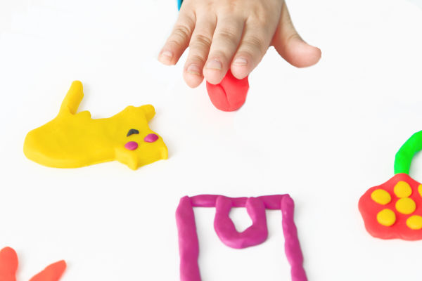 Make play dough from Kool-aid!  This play dough recipe is taste-safe and requires NO COOKING! A great kids activity for all ages #playdoughrecipe #playdough #koolaidplaydoughrecipe #koolaidplaydough #playdoughrecipenocreamoftartar #playdoughrecipenocook #playdoughrecipeeasy #koolaidplaydoughrecipenocook #nocookplaydough #growingajeweledrose