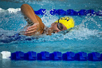 Swimmer Breathing Side of Mouth Image of swimmer in a pool lane doing front crawl drills, breathing from the side of his mouth