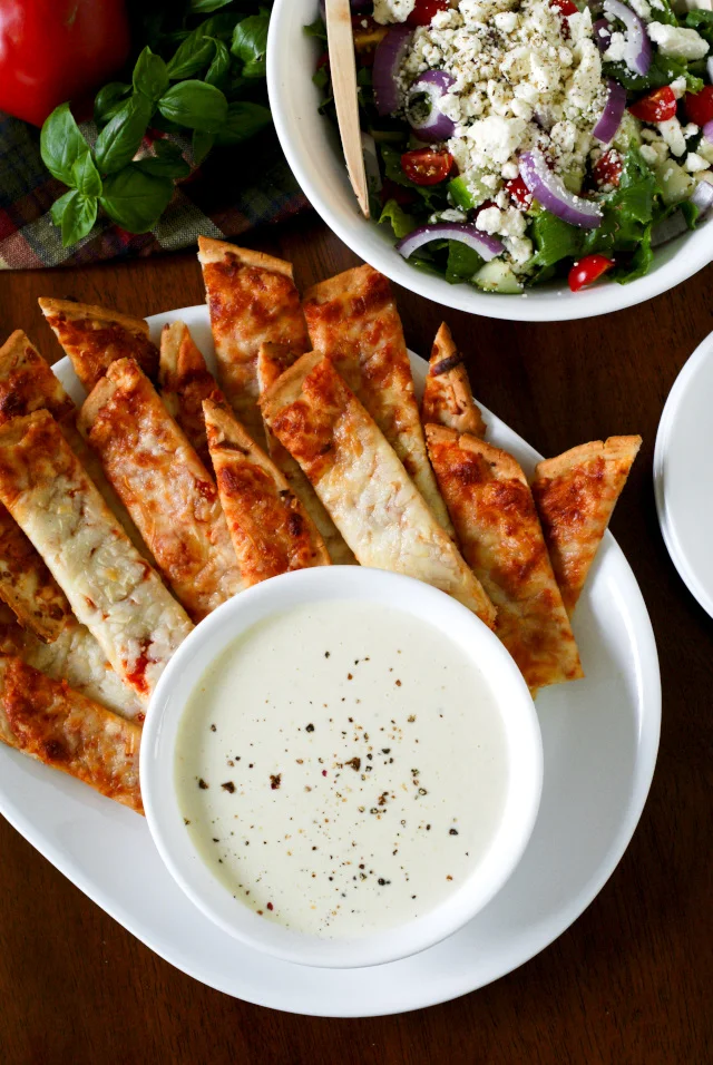 Pizza Sticks with Three Cheese Alfredo Dip | thetwobiteclub.com