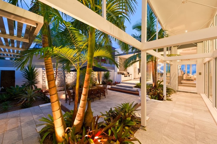 Terrace at night in Coastal Oasis landscape project by Urban Exotic