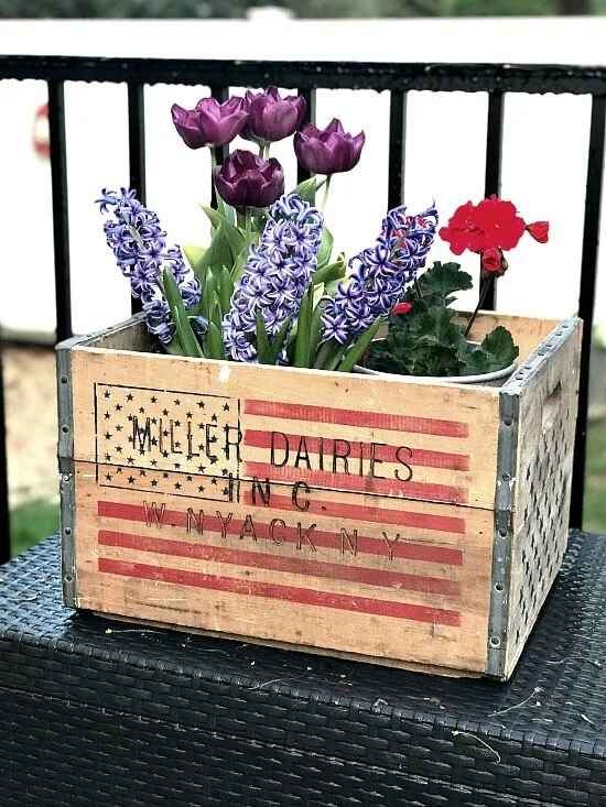 American flag crate filled with flowers