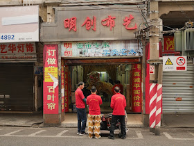 Lion dance troupe at a shop in Jiangmen