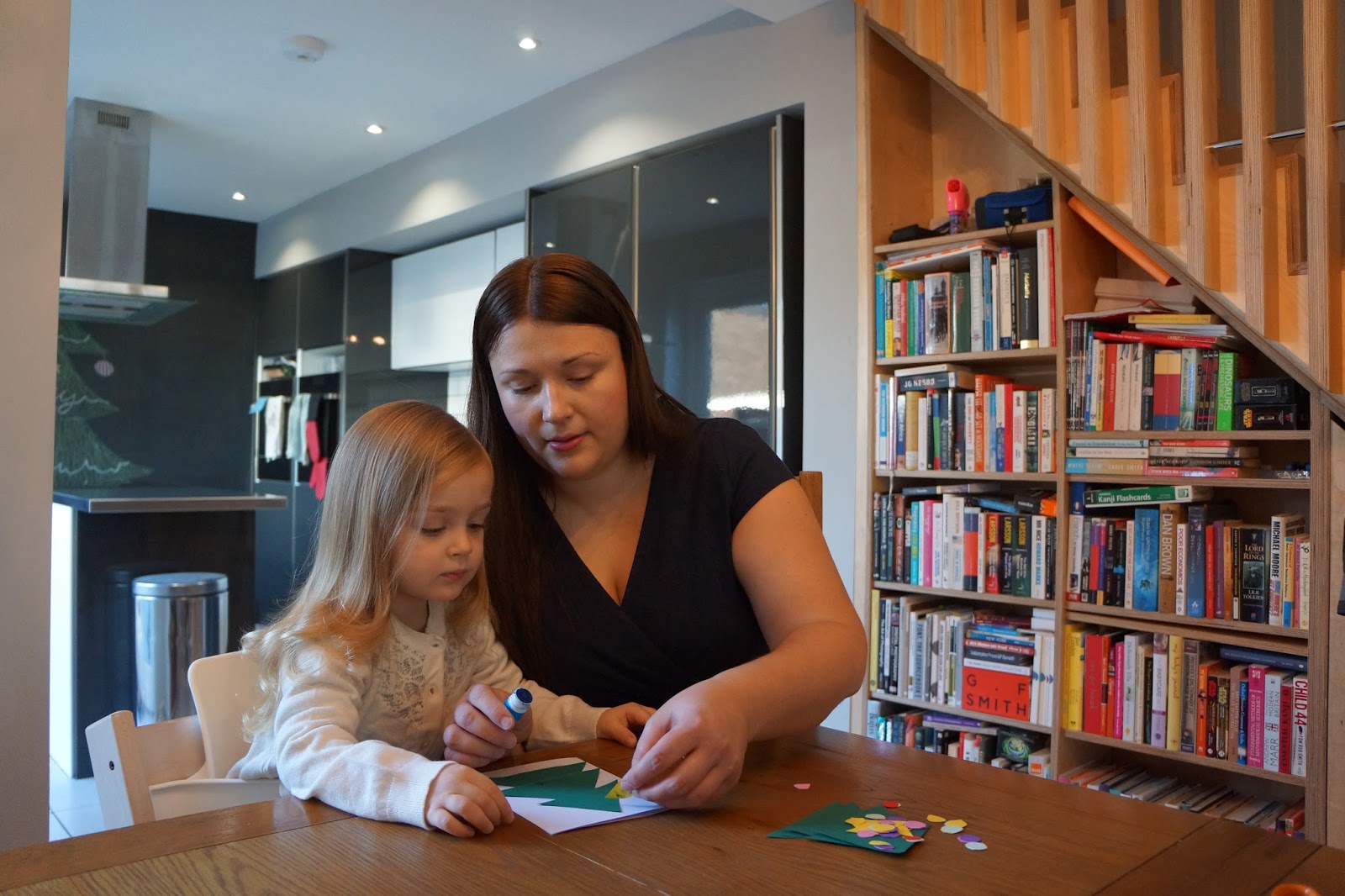 mum and daughter crafting paper cards