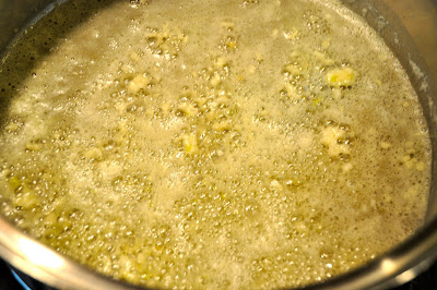 Triple cheese mac garlic roasting in a pan