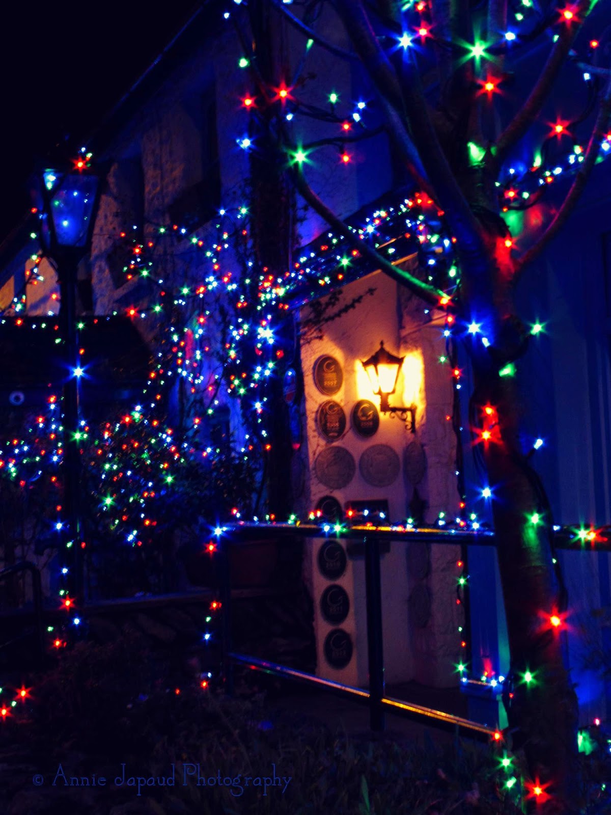 Christmas magic in Moycullen © Annie Japaud Photography Christmas lights around a door frame