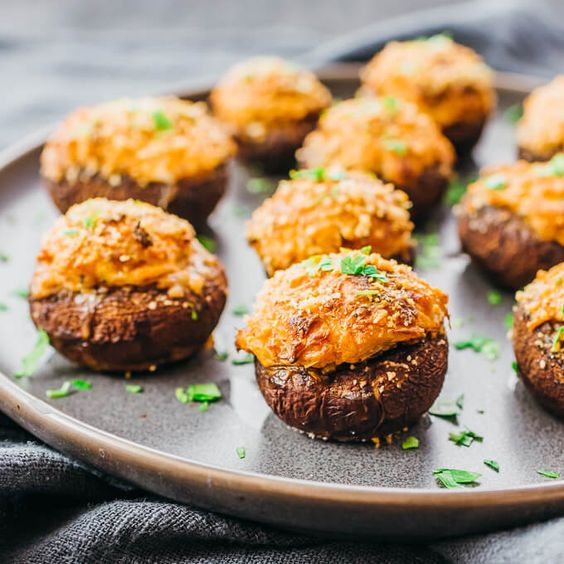 Make this for dinner: the best crab stuffed mushrooms recipe with cream cheese! #lowcarb #keto #healthy #appetizers It's super easy and simple, and reminds me of the ones at Red Lobster, Outback. or Olive Garden. My healthy version skips panko bread crumbs so it's low carb & keto. I use real canned crab lump meat & cream cheese to stuff the mushroom caps. garlic / seafood / baked / families / gluten free / diet