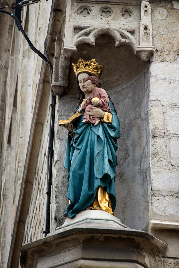 Madonna with infant on street corner