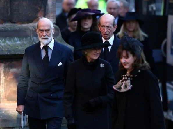 Kate Middleton wore the black Alexander McQueen coat, Gianvito Rossi pumps, Pretty Ballerinas Mascaro black velvet clutch