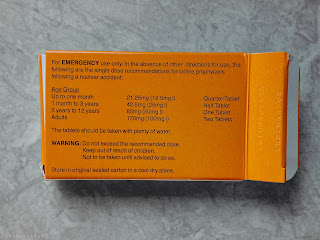 Back side of orange box containing six 85mg Potassium Iodate tablets in blister pack.
