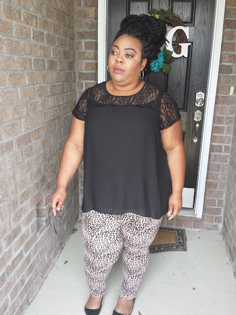 Curvy blogger with black chiffon blouse and leopard print jeggings Plus size outfit of leopard print jeggings, black flats and black chiffon blouse