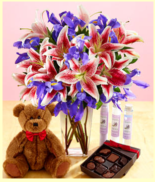 http://www.flowerpicturegallery.com/v/valentine-flower-pictures/Valentine+gift+set+with+pink+lilies+with+purple+flowers+comes+with+teddy+bear+and+chocolate+box.PNG.html