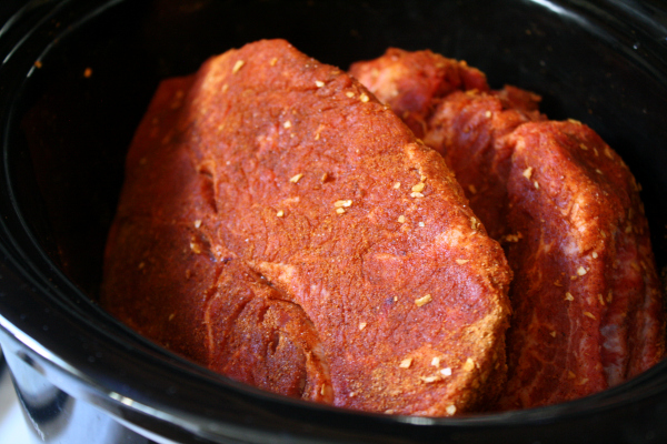 beef chuck roast seasoned in slow cooker