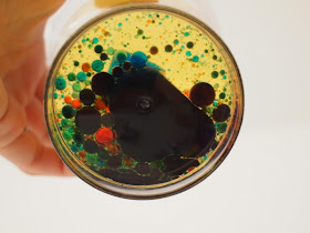 Colored water droplets in oil