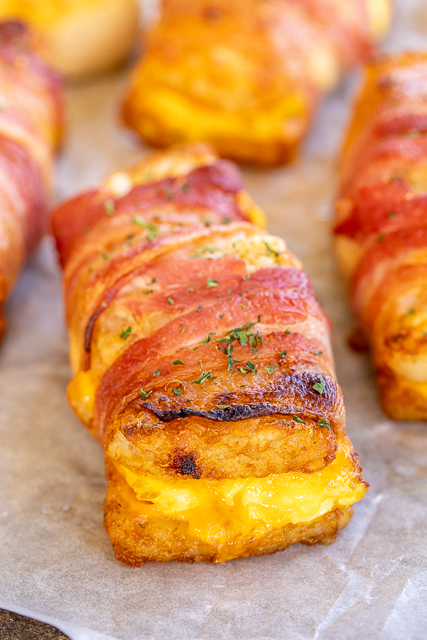 Bacon Wrapped Egg & Cheese Hash Browns - seriously DELICIOUS!!! Frozen hash brown patties stuffed with scrambled eggs and cheddar cheese and wrapped in bacon. Best breakfast EVER!!! Can make as many as you need at a time. Can assemble ahead of time and refrigerate or freeze for later. #breakfast #brunch #hashbrowns #bacon #baconeggcheese #freezermeal Bacon Wrapped Egg & Cheese Hash Browns - seriously DELICIOUS!!! Frozen hash brown patties stuffed with scrambled eggs and cheddar cheese and wrapped in bacon. Best breakfast EVER!!! Can make as many as you need at a time. Can assemble ahead of time and refrigerate or freeze for later. #breakfast #brunch #hashbrowns #bacon #baconeggcheese #freezermeal