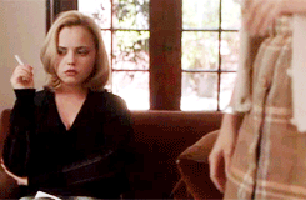 Christina Ricci in a playful birthday-themed GIF, her energy infectious and full of life