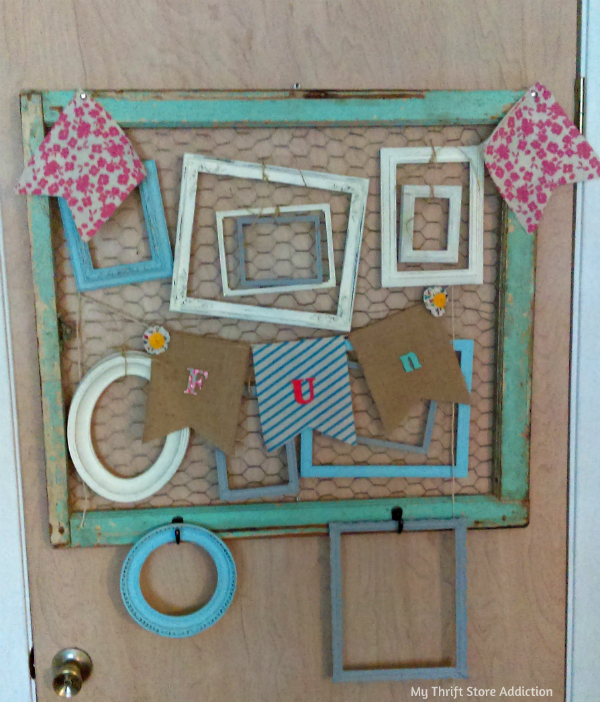 A chicken wired frame holds more chalk painted frames available at Etsy Thrift Store Addiction: mythriftstoreaddiction.blogspot.com Craft studio reveal