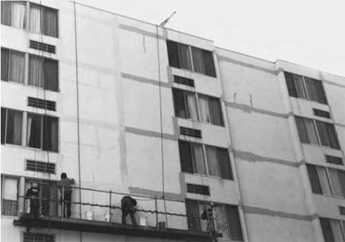 Preparation of substrate including crack repair prior to elastomeric coating application. 