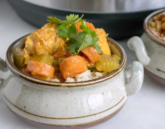 Make a quick but flavorful curry right in your instant pot. A few simple ingredients and a about a half hour is all you need to get this curried chicken and vegetables on the table. bowl of rice with chicken and veggie curry on top