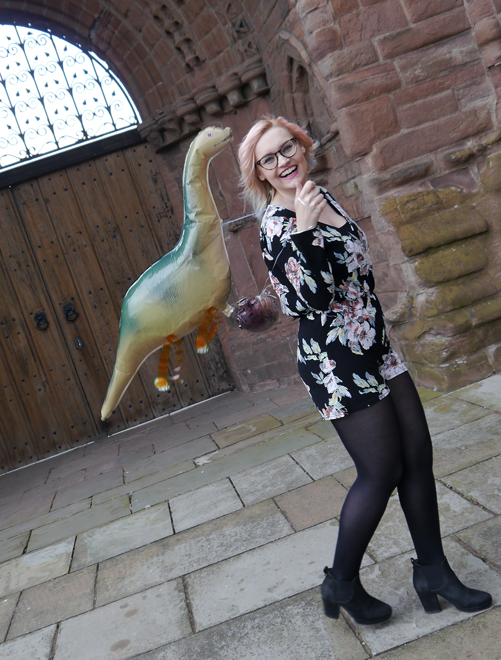 Fun with dinosaur balloons to add to a fashion blog photoshoot dinosaur themed fashion shoot, Arbroath Abbey, floral Boohoo jumpsuit, icecream summer hair dye trend, dinosaur balloon for a dinosaur themed party