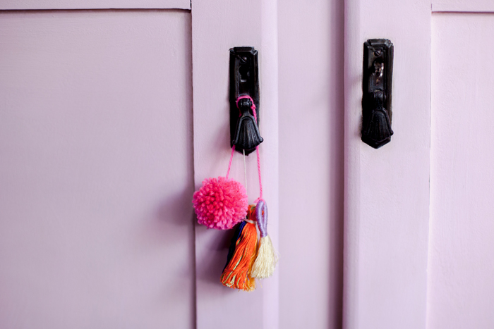 pink chalk painted furniture pink cabinet with tassels and pom pom