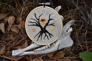 https://www.etsy.com/listing/487127994/cosmic-eye-embroidery-hoop-folk-horror?ref=shop_home_active_6