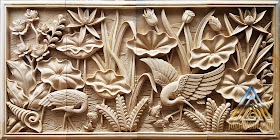 Relief gambar burung bangau dan bunga lotus