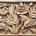 Relief gambar burung bangau dan bunga lotus