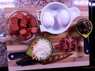 Ingredients for a recipe arranged in cups.