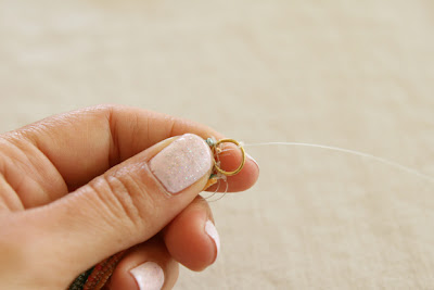 tying the necklace wire to the jump ring