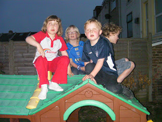 sitting on a playhouse in pub beergarden