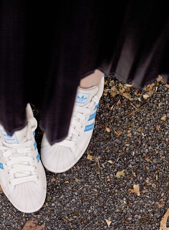wearing adidas sneakers with a skirt