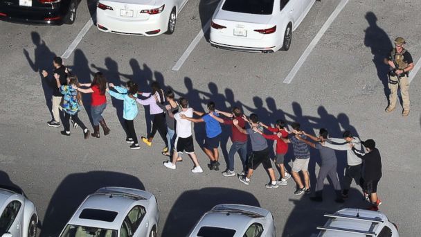 PHOTO: People are brought out of the Marjory Stoneman Douglas High School after a shooting at the school, Feb. 14, 2018, in Parkland, Fla. (Joe Raedle/Getty Images)