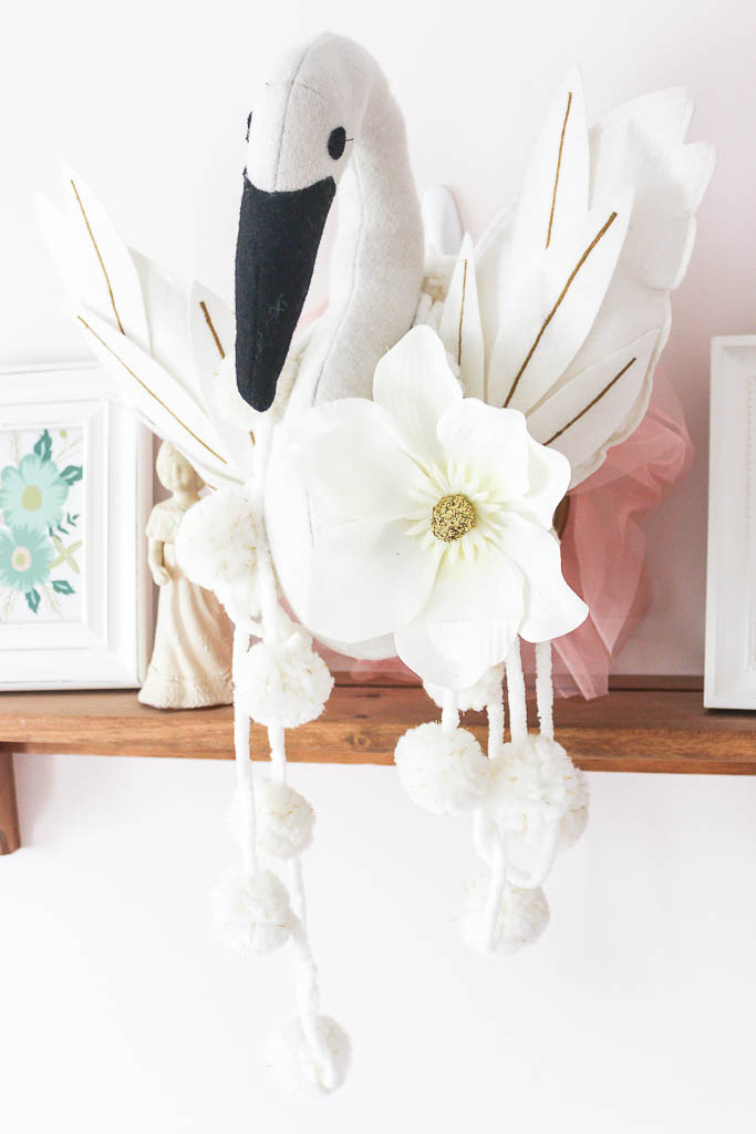 Every room deserves a touch of Christmas! Tour this sweet holiday baby's nursery dressed up with blush pink, white, and gold seasonal decor.