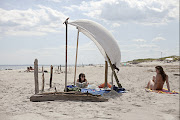 Nice photo by Nolan Conway in today's NY Times in article on a hidden beach . (sailbeachshade)