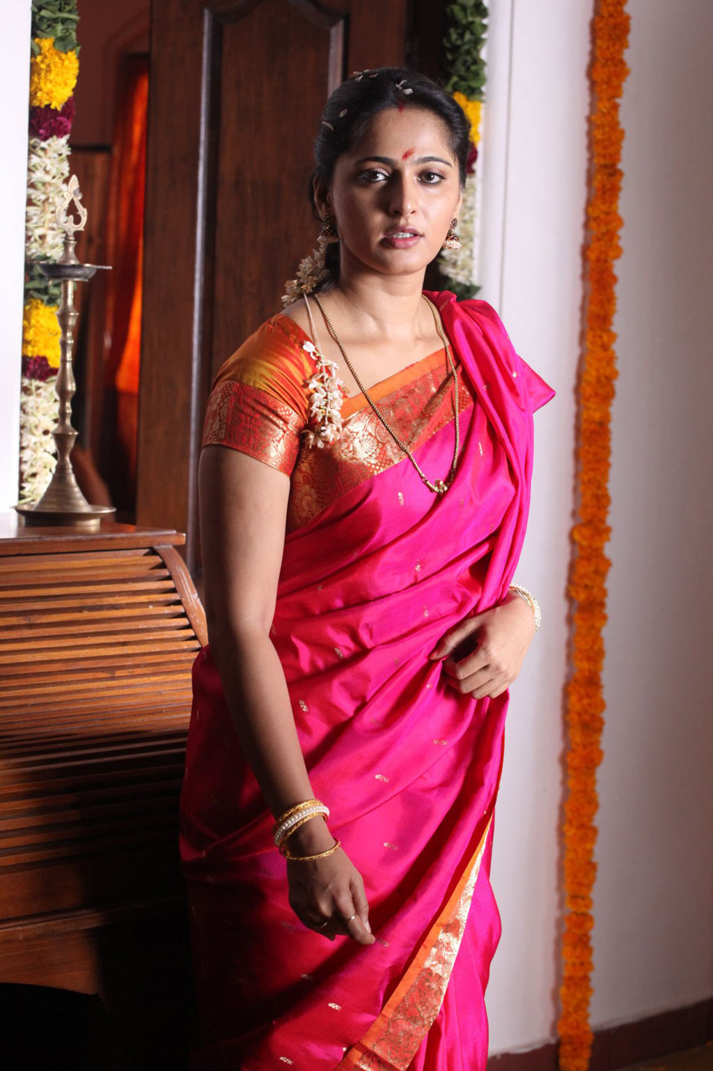 Indian Girl Anushka Shetty Long Hair Stills In Red Traditional Saree