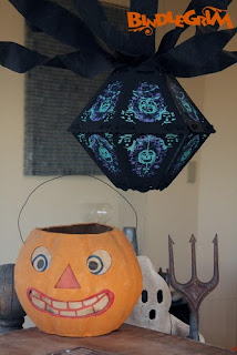 Bindlegrim vintage style Halloween lantern hangs with crepe paper over antique pumpkin and a newer ghost by Hobgoblin