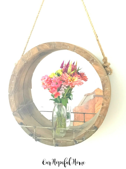 round wooden farmhouse mirror vintage milk bottle vase fresh cut flowers